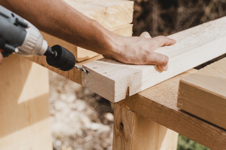 high-view-person-holding-hammer-drill